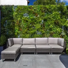 حصار محرمانه ساخته شده با پانل های گیاهان جعلی ، واحه زیبایی را ایجاد می کند
