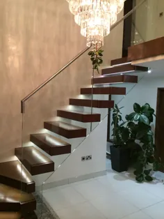 Ultimate Luxury ... Classical Cantilever Stair w / Stunningier chastelier - Stairkraft