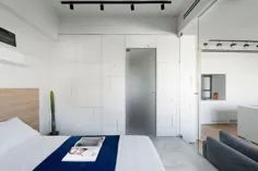 دیوار آجری سفید شده در داخل اتاق خواب کوچک و معاصر - دکوئیست