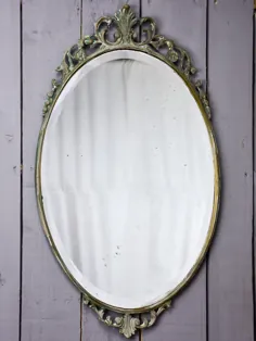 آینه بیضی شکل با قاب آهنی