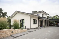 خانه ییلاقی زاویه دار با سقف شیب دار و باغ زمستانی - |  HausbauDirekt.de