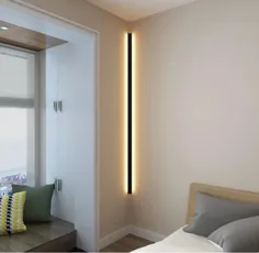 چراغ دیواری خطی مینیمالیستی منجر به نورپردازی اتمسفر برای اتاق نشیمن اتاق خواب هتل می شود