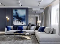 دکوراسیون اتاق نشیمن لوکس و آبی و خاکستری با کارهای هنری انتزاعی آبی و مبل مقطعی دنج و خاکستری