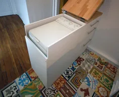 ماشین لباسشویی زیر پیشخوان آشپزخانه پنهان شده است