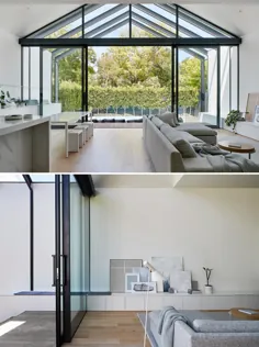 دیواری از ویندوز با درهای کشویی شیشه ای فضای داخلی این خانه را به فضای بیرون متصل می کند