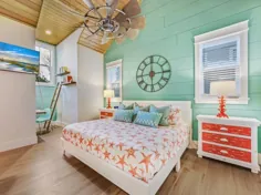 ایده اتاق خواب ساحلی از خانه ای در فلوریدا به سبک کلبه ای سبز دریایی و مرجانی