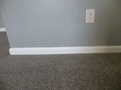 12 دیوار رنگی که با فرش خاکستری کار می کند